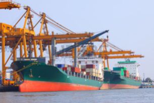 35985294-commercial-ship-with-container-on-shipping-port-for-import-export-and-logistic-transportation